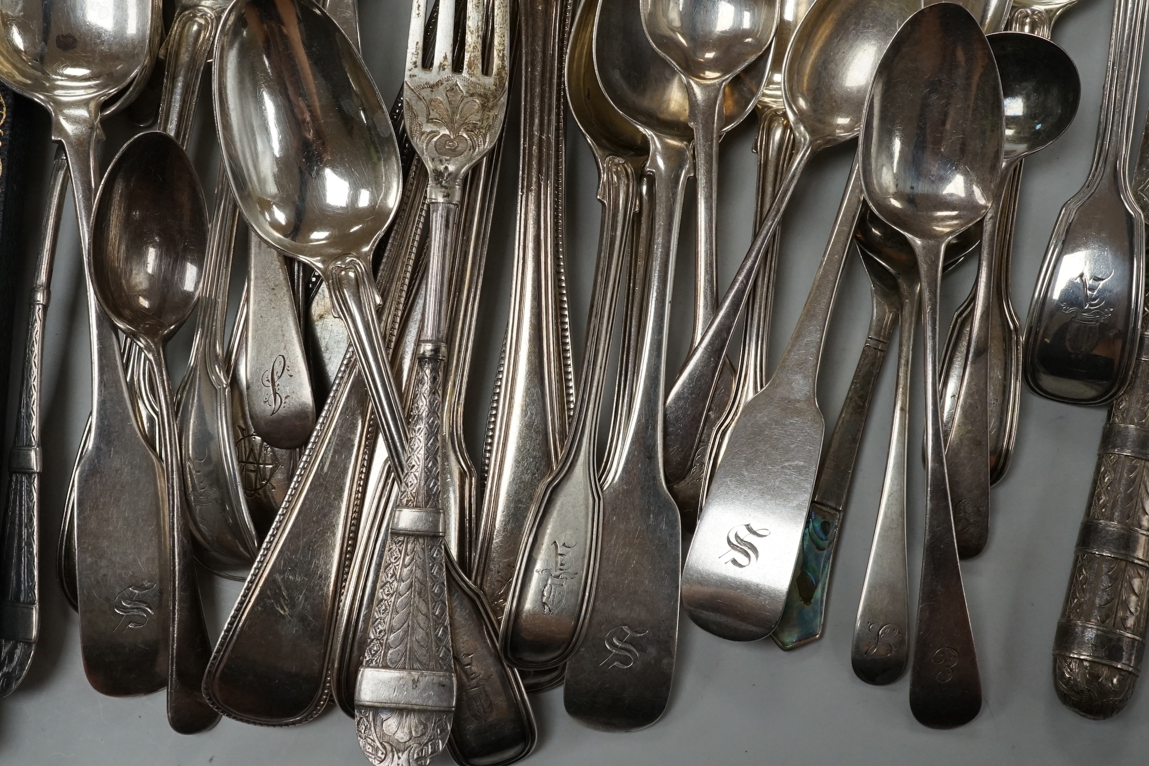 A quantity of assorted mainly 19th century and later silver flatware, various date and makers including three cased sets, 37.5oz.